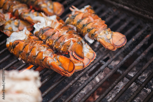 Freshly grilled lobsters. Lobster bbq, no claws. Street food.