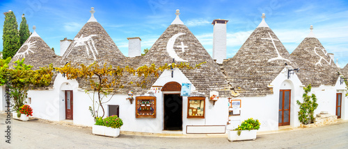 Streets of Alberobello town with Trulli houses in Apulia, Italy photo