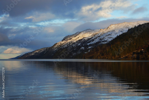 Evening winter scenery by Loch Ness, snowy highlands