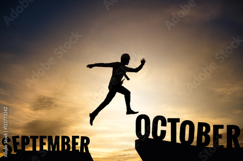 Businessman or worker jump from SEPTEMBER to OCTOBER.