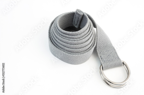 Coiled yoga belt on white background. photo