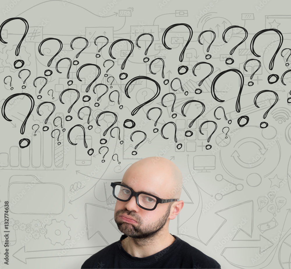 Bored attractive bold man geek with glasses asking question to h Bored attractive bold man geek with glasses asking question to h