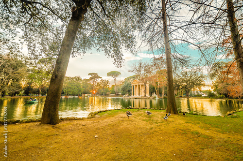 lake with roman building in park