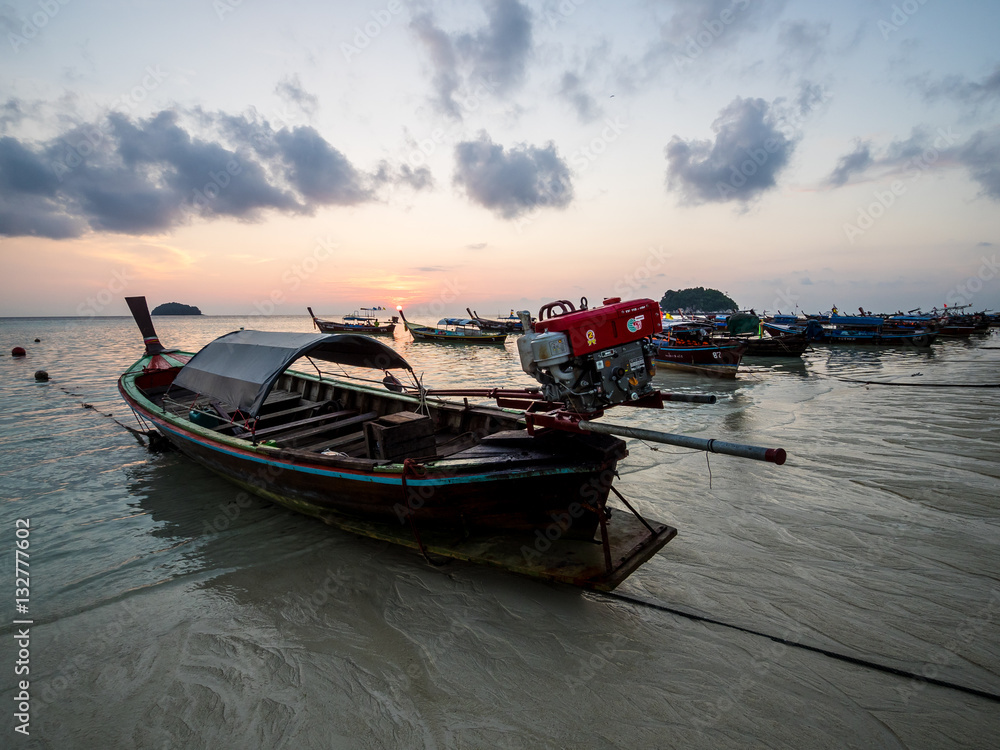 Longtail boat in the sunrise on Koh Lipe