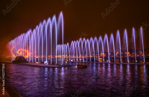 Photography Fountains light art at night during the Amsterdam Light Festival.