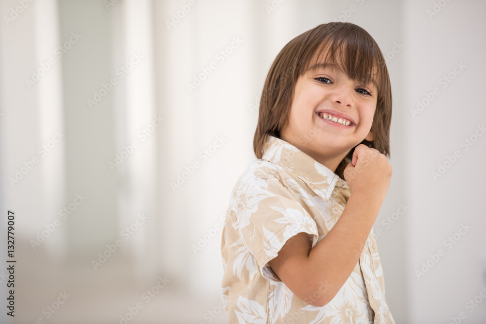 Cute school kid posing in studio with different facial expressio Cute school kid posing in studio with different facial expressio