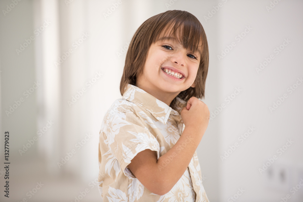 Cute school kid posing in studio with different facial expressio Cute school kid posing in studio with different facial expressio