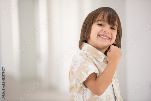 Cute school kid posing in studio with different facial expressio