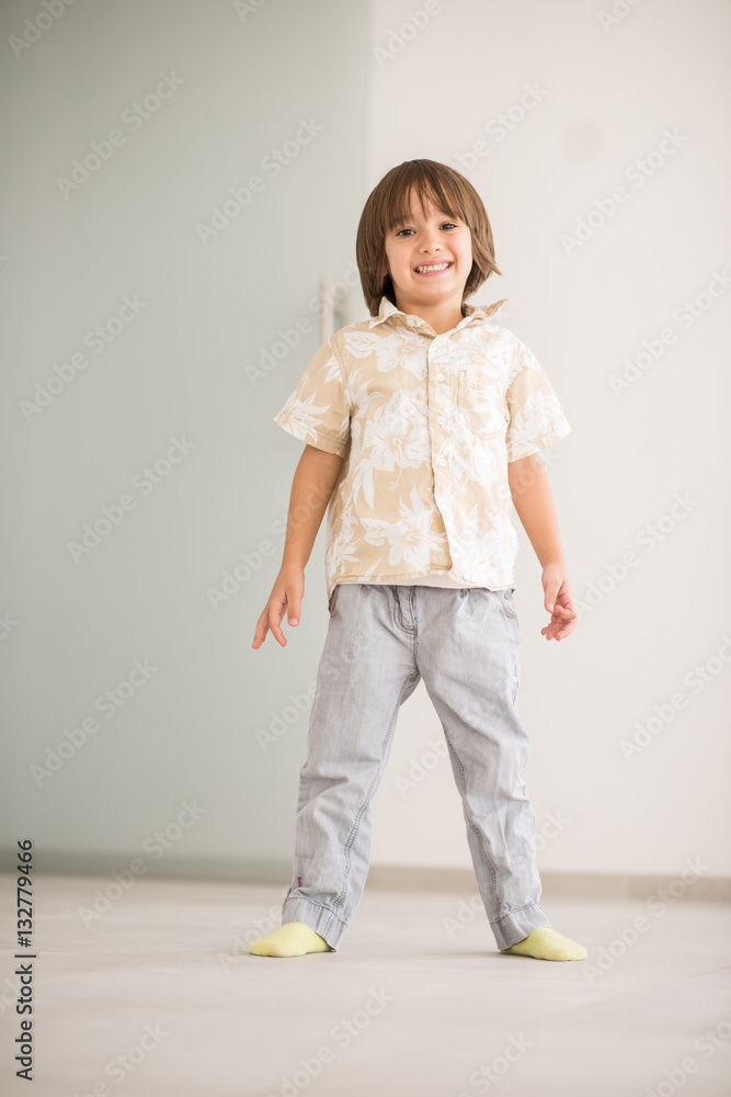 Happy children having fun and posing in new modern home