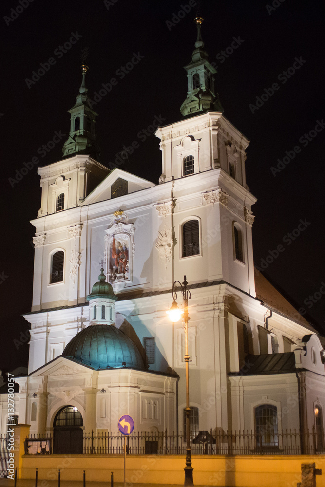 Collegiate Church of St. Florian in the historical part of Krakow at night. Church was built between 1185 and 1216. Present appearance is the result of a Baroque renovation. Collegiate Church of St. Florian in the historical part of Krakow at night. Church was built between 1185 and 1216. Present appearance is the result of a Baroque renovation.