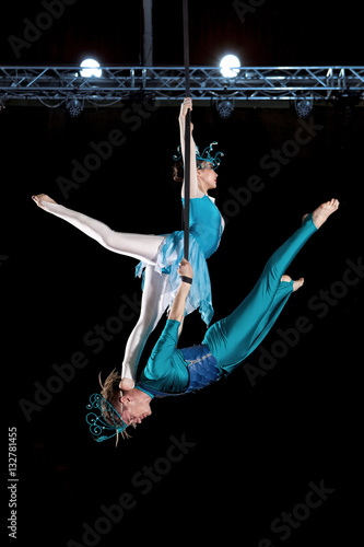 Young couple circus air gymnast