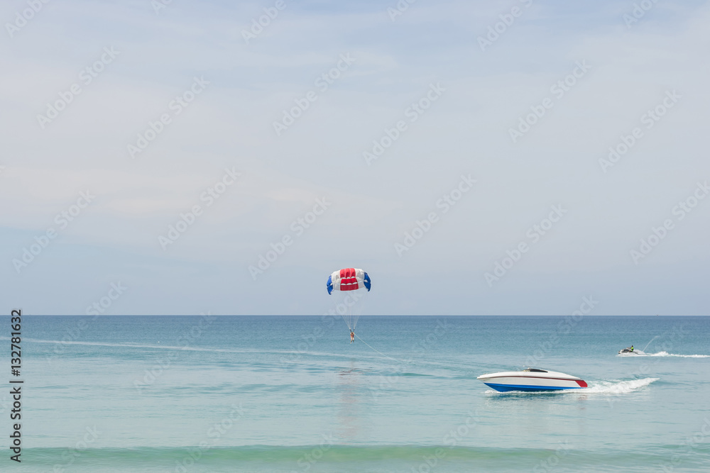 Parasailing on the beach with speed boat in Phuket,Thailand