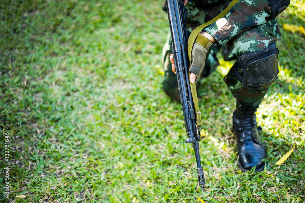 Military observer seats on the grass. Military observer seats on the grass.
