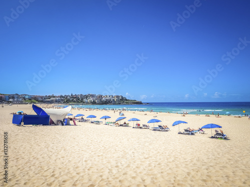 People sunbathing on the Bondi Beach in Bright Sunny Day, Australia