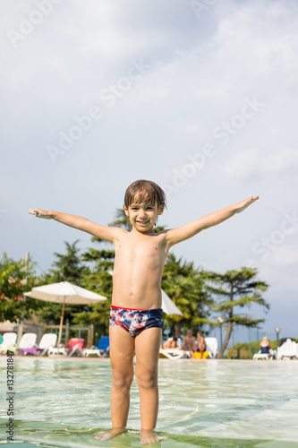 Happy time for kids of fun and enjoyment on summer swimming pool