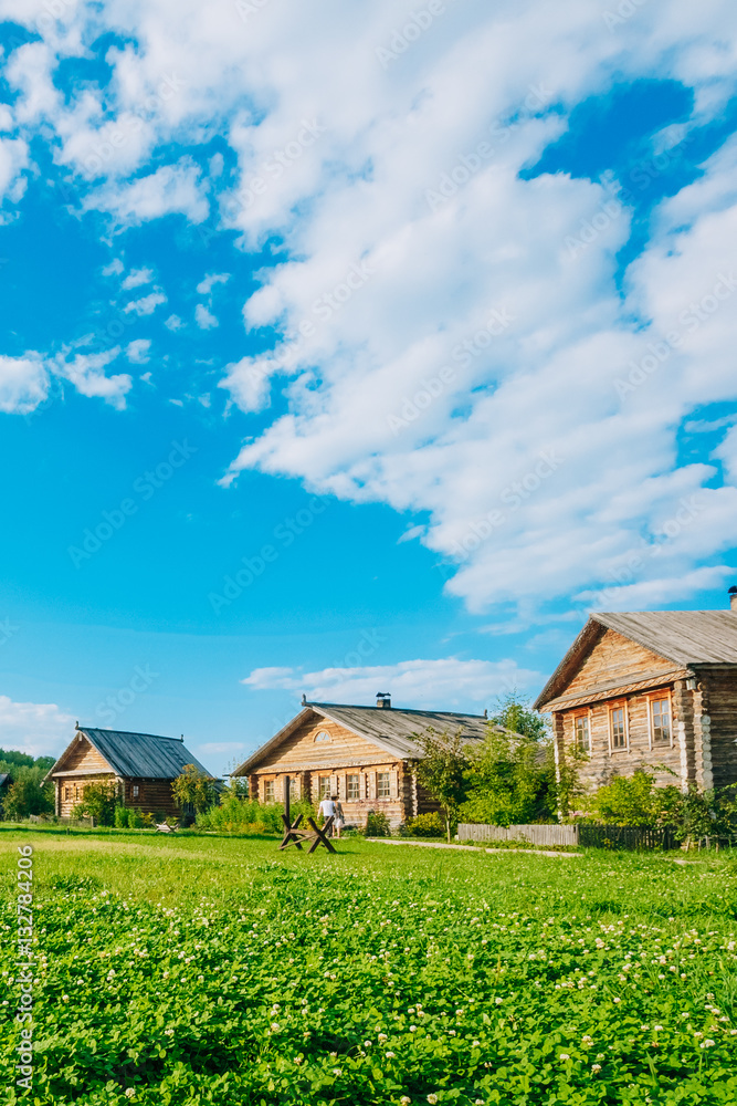 Obraz premium Landscape with Russian wooden houses. Countryside
