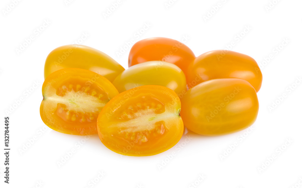 whole and half cut yellow cherry tomato on white background