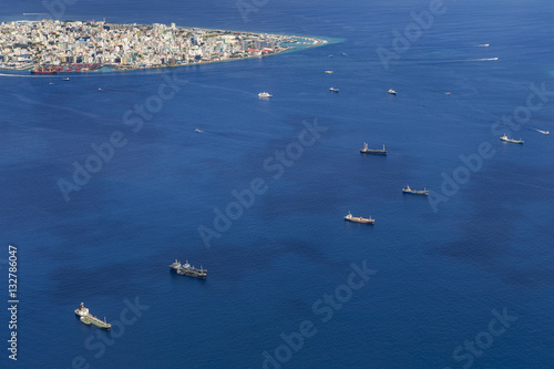 Cargo ships floating near the Male city