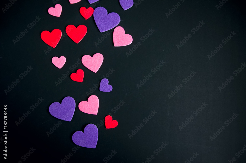 Colored hearts over black background. Colored hearts over black background.