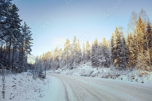 Wintry road in Finland. Image has a vintage effect applied.