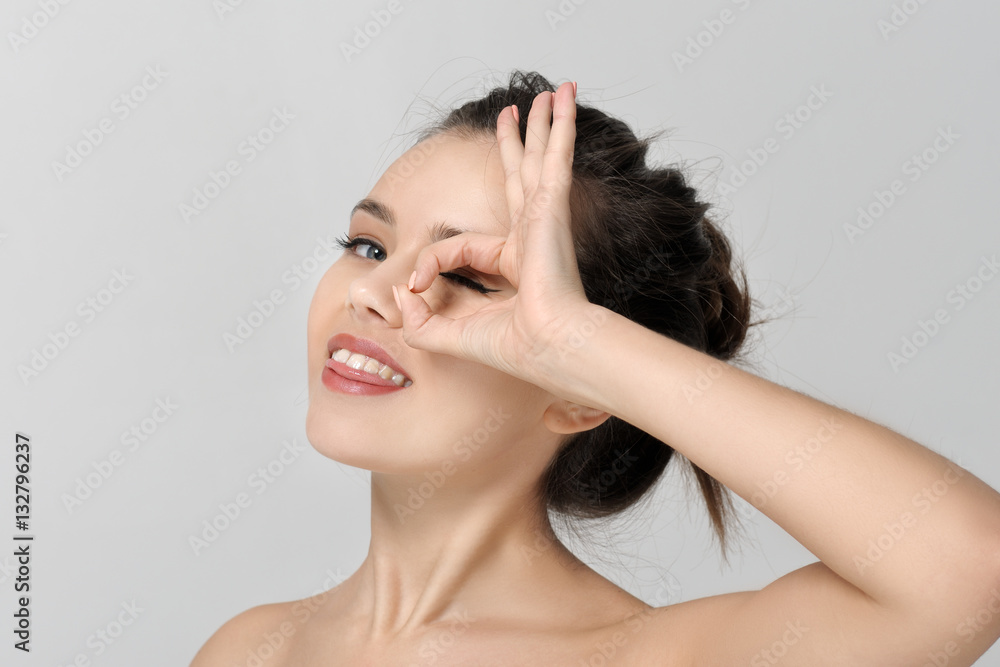Girl shows a sign all ok and smiles Girl shows a sign all ok and smiles