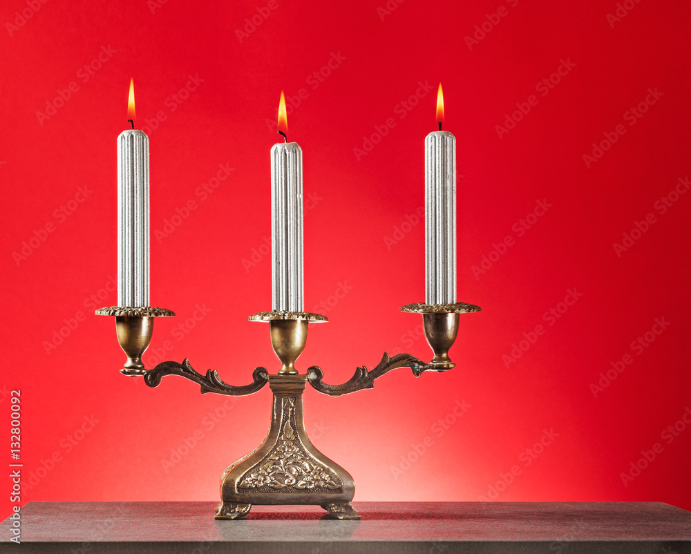 Fototapeta premium Candlestick with burning candles