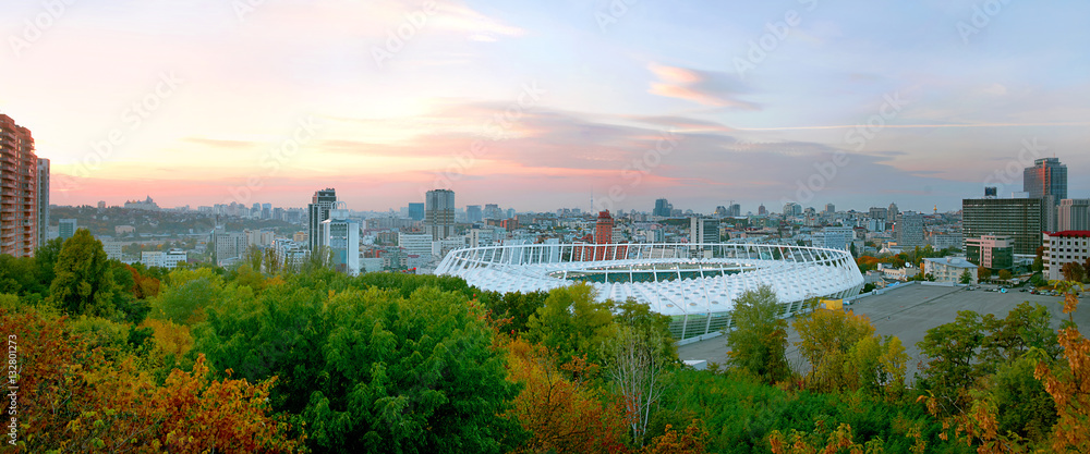 Fototapeta premium Panoramic cityscape of the centre of Kiev in the sunset: stadium, downtown, skylines, hotel. Ukraine. East Europe