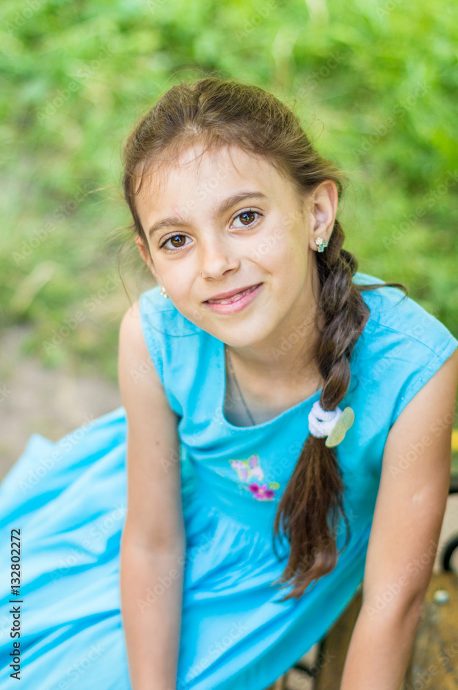 Portrait of a beautiful and happy girl in the Park