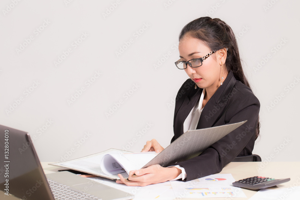 Portrait of Business women looking report on work table Portrait of Business women looking report on work table