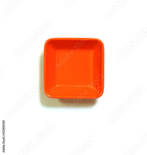Close up of orange tray on a white background