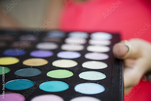 colorful eyeshadow palette and blush for make-up closeup