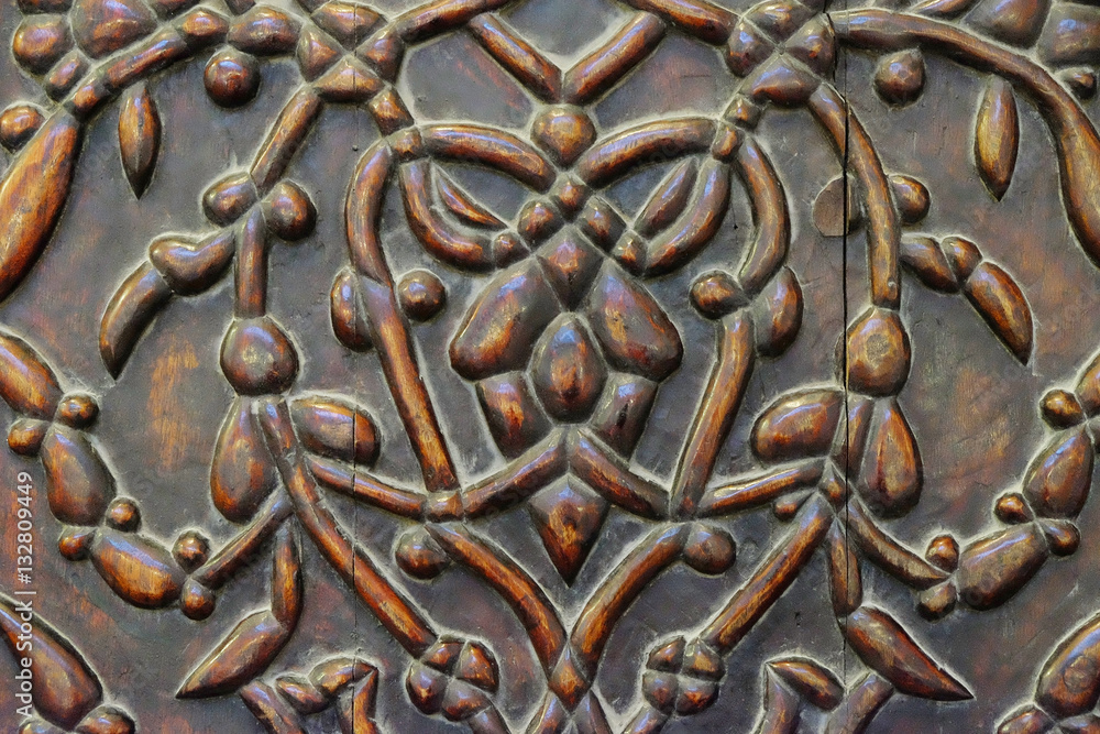 old Central Asian pattern on wooden surface old Central Asian pattern on wooden surface