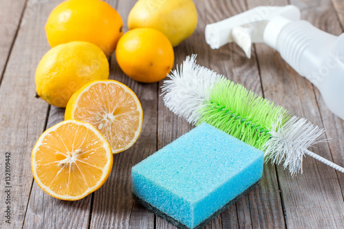 Eco-friendly natural cleaners baking soda  lemon and cloth on wooden table