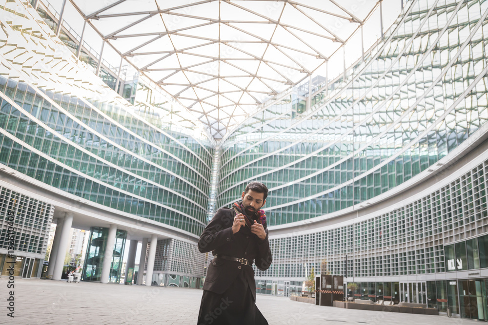 Indian man posing in an urban context. Indian man posing in an urban context.