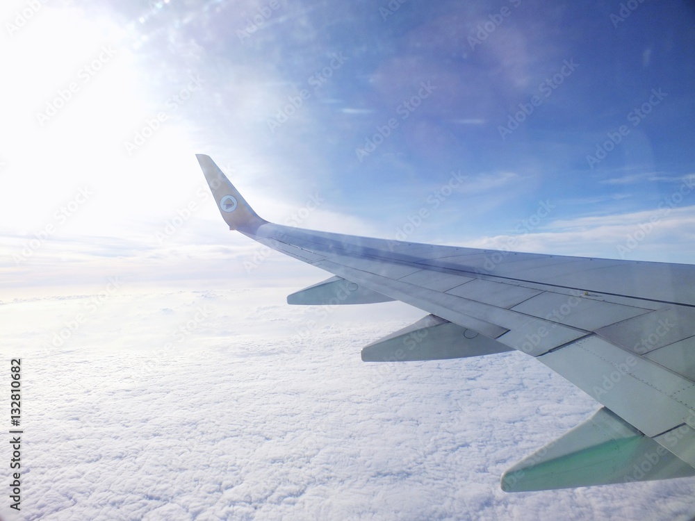 Obraz premium clouds and sky as seen through window of an aircraft
