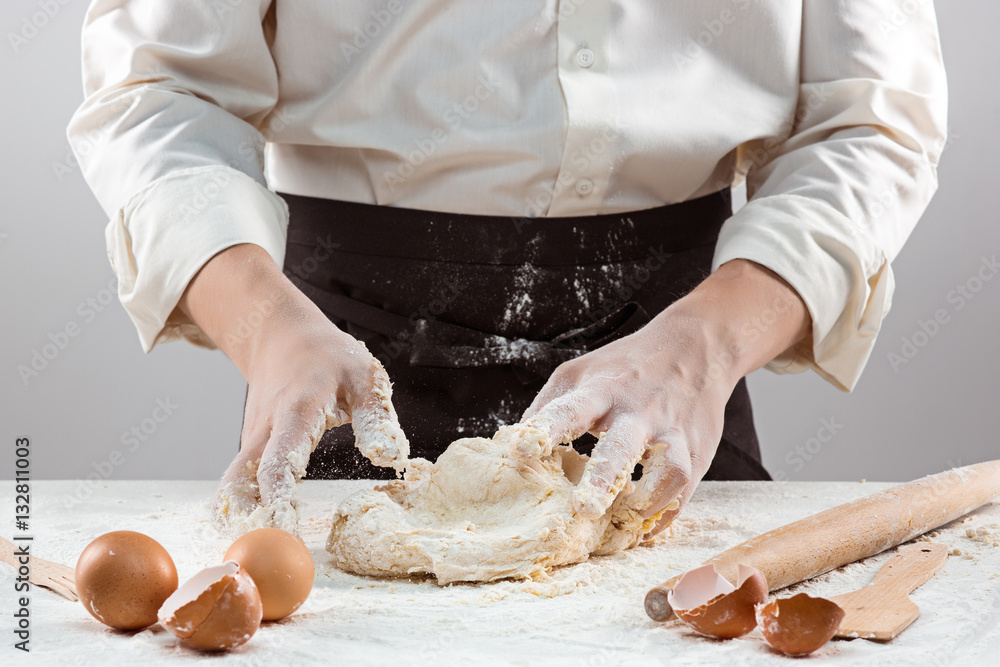 Hands kneading a dough Hands kneading a dough