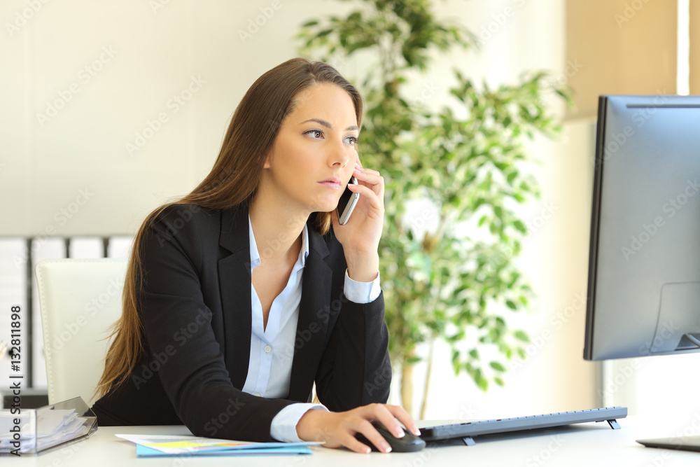Concentrated businesswoman on the phone Concentrated businesswoman on the phone