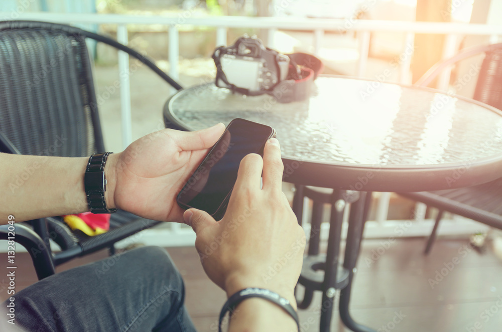 Man using a mobile phone in coffee shop Man using a mobile phone in coffee shop