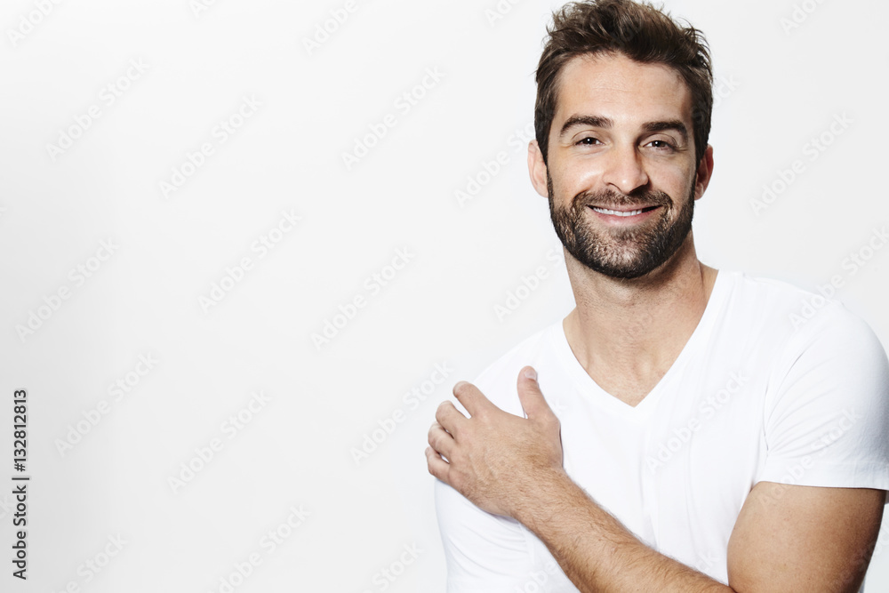 Stubble guy in white t-shirt, smiling Stubble guy in white t-shirt, smiling