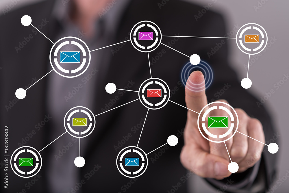 Man touching an email network on a touch screen Man touching an email network on a touch screen