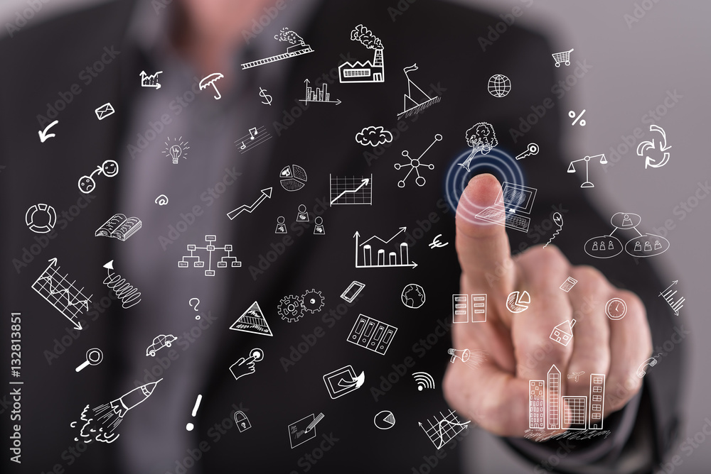 Man touching a business doddles on a touch screen Man touching a business doddles on a touch screen