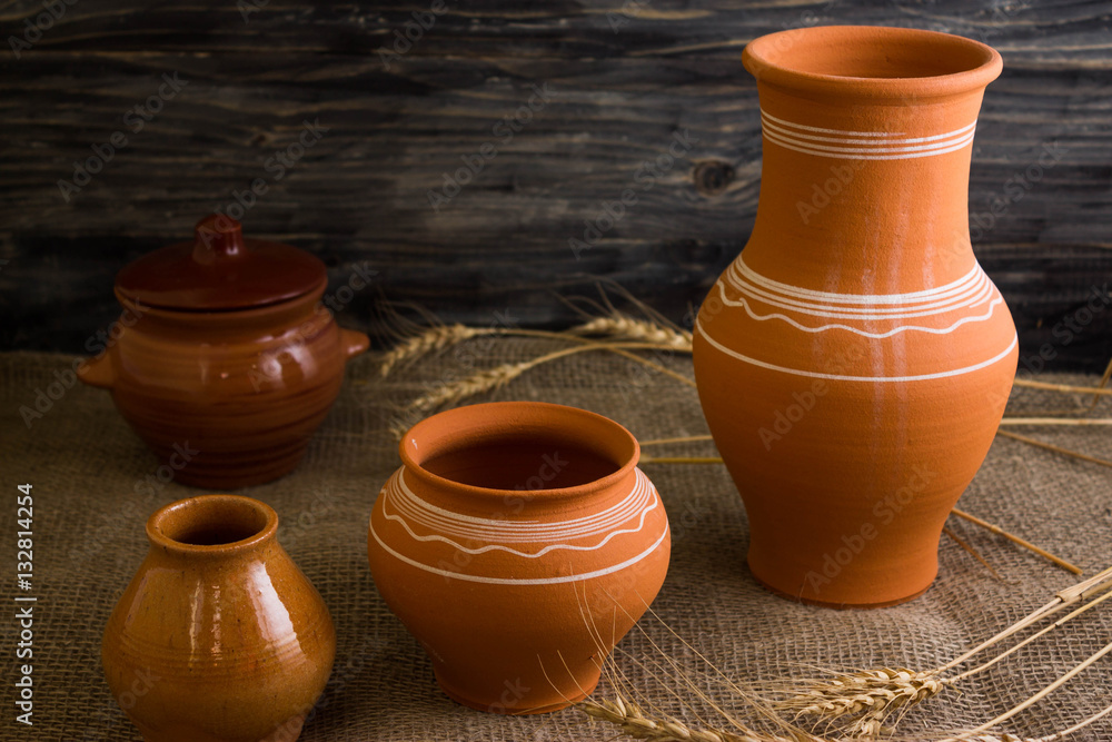 Pottery on a wooden background in rustic style Pottery on a wooden background in rustic style