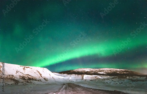 Northern lights Aurora borealis above Mountains Landscape Winter Travel scandinavian night scenery natural colors