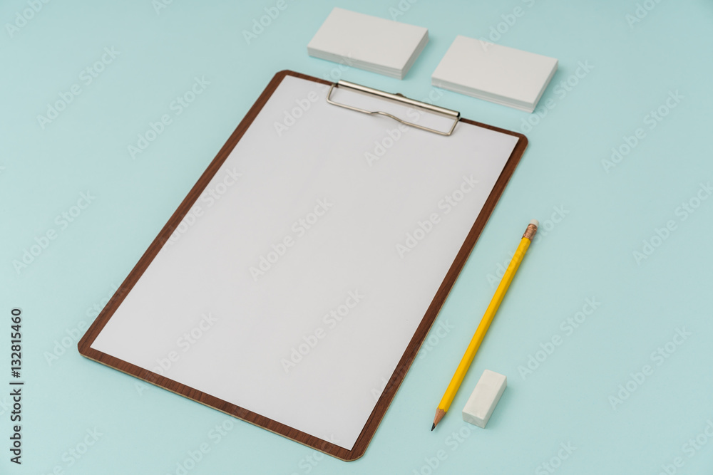 Clip board, paper,pencil and business card on blue background . Clip board, paper,pencil and business card on blue background .