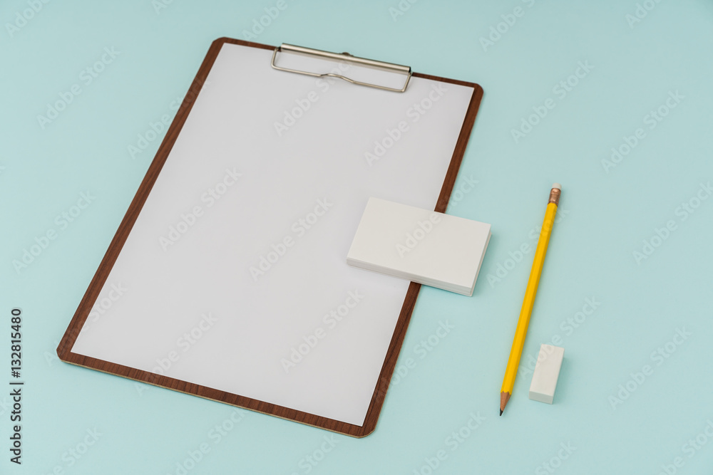 Clip board, paper,pencil and business card on blue background . Clip board, paper,pencil and business card on blue background .
