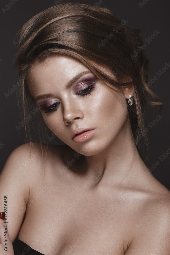Beautiful girl with perfect skin, evening make-up, wedding hairstyle.Beauty face. Picture taken in the studio. Beautiful girl with perfect skin, evening make-up, wedding hairstyle.Beauty face. Picture taken in the studio.