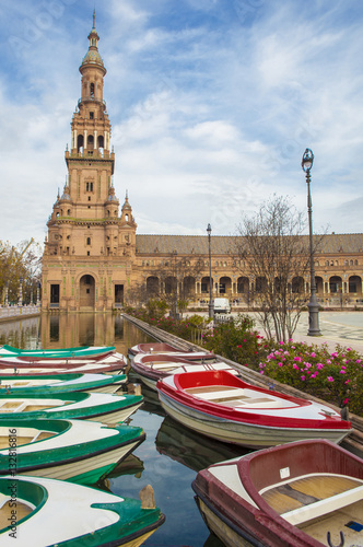 Boats docked at the canal with norht tower at de bottom photo