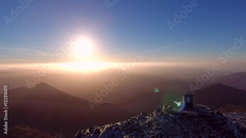 Spectacular panning aerial shot of the summit of Mount Snowdon. photo