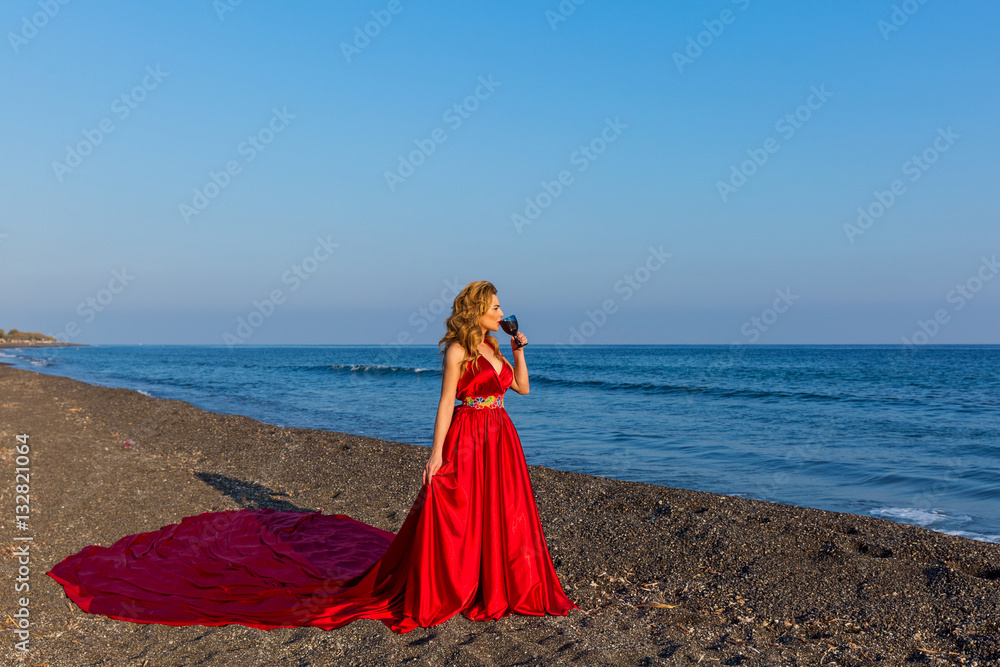 Woman with a glass of wine and sea Woman with a glass of wine and sea