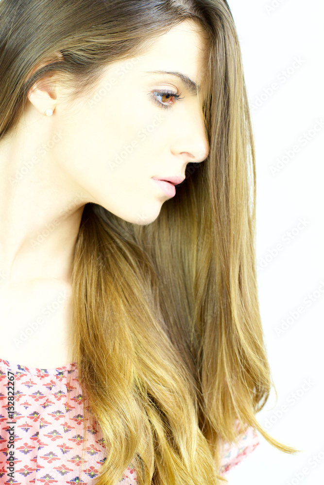 Naklejka premium Portrait of gorgeous young woman with beautiful skin and hair medium shot